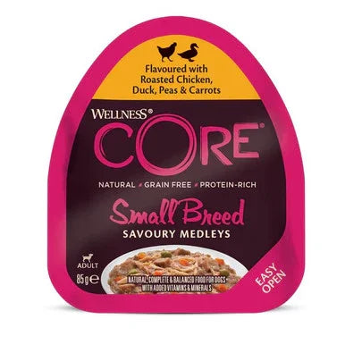 Wellness CORE Small Breed dog food pâté with roasted chicken, duck, peas, and carrots in pink packaging