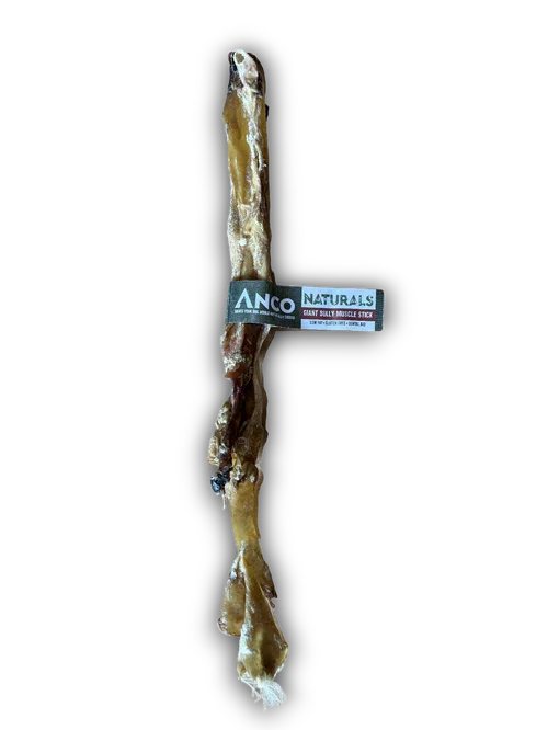 Anco Naturals Giant Bully Muscle Stick dog chew treat with black label on black background