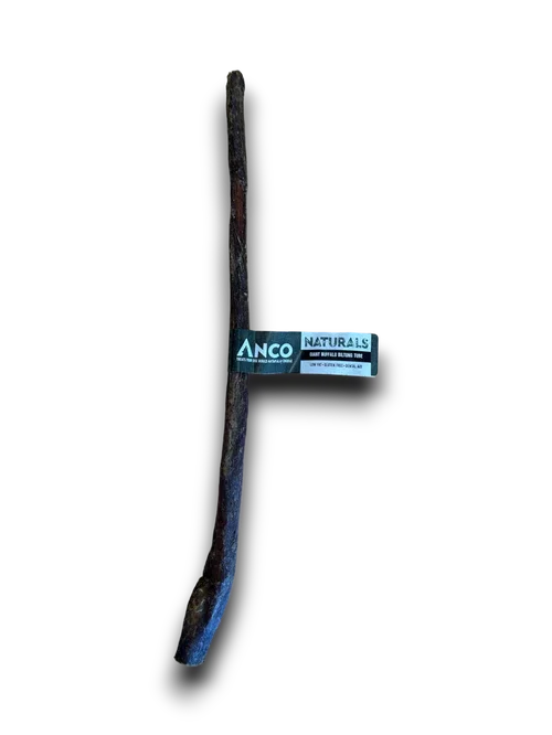 Anco Naturals dark brown natural dog chew stick with product label on black background