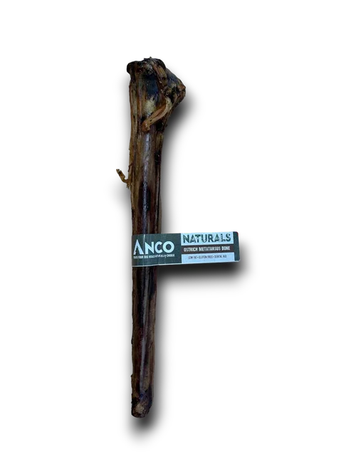 Anco Naturals ostrich metatarsus bone dog chew on black background