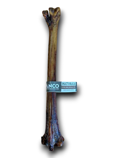 Anco Naturals long ostrich bone dog chew with a label on a black background