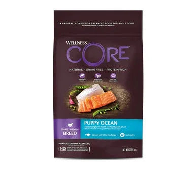 Wellness CORE Puppy Ocean grain-free dog food with salmon and whitefish on purple and blue packaging